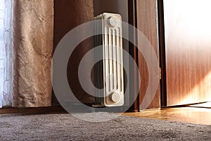 Interior radiator carpet wooden door and low point of view
