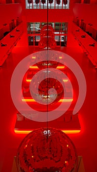 Interior with red light of a beautiful modern hall. Vertical frame