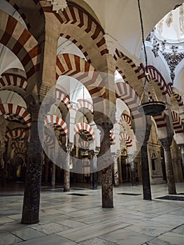 Interior red white striped architecture of Mezquita islamic mosque catholic church Cathedral Cordoba Andalusia Spain