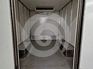 interior refrigerated truck is insulated and hygienically white for transporting photo