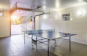 Interior of residential house or hotel with a table for tennis