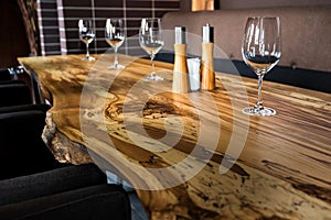 Empty wine glasses on slab table in restaurant