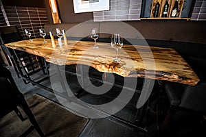 Empty wine glasses on slab table in restaurant
