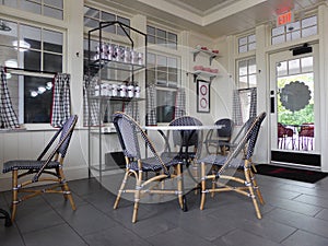 Interior of a restaurant with pattern design of white, black and red colors. Chairs and tables in a restaurant or a cafe