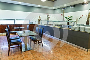 Interior of the restaurant of the resort European hotel is all inclusive, large hall with tables waiting for their guests