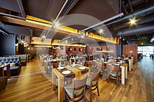 Interior of restaurant with wooden furniture and