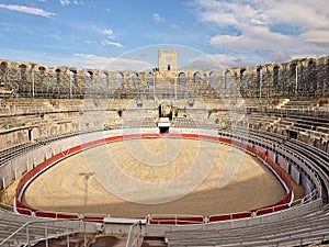 Interior of Roman amphitheatre with arena and bleachers in Arles, France