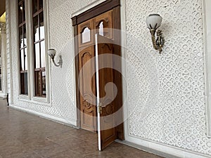 Interior of a room with arabic pattern and wooden doors