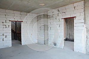 Interior room under construction, metal door lintels. Wall without plasterwork photo