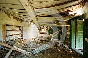 Interior Of Ruined Abandoned Country House With Caved Roof, Evacuation Zone After Chernobyl Disaster