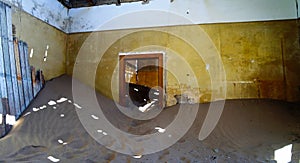 Interior of ruined house in ghost-town Kolmanskop Namibia