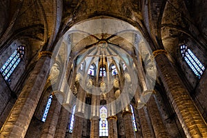 Interior of Santa Maria del Mar Basilica in typical Catalan Gothic. Detail of the apse with the Crowning of the Virgin Mary in the