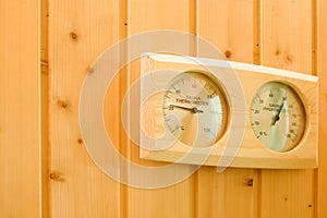 Interior of the sauna. Measurement of humidity and temperature by thermometer and hygrometer. Health safety