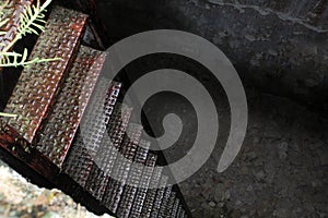 Interior of a sewer with metal stairs