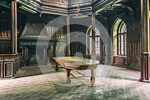 Interior of Sharovsky Castle with table and fireplace