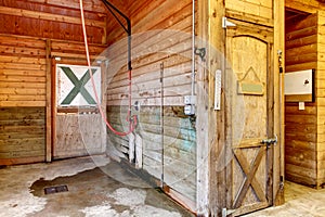 Interior of shed with horse stables.