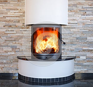 An interior shot of a modern marble fireplace