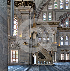 Interior shot of Nuruosmaniye Mosque with minbar platform, arches & colored stained glass windows, Istanbul, Turkey