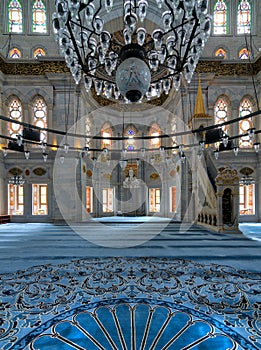 Interior shot of Nuruosmaniye Mosque overlooking niche Mihrab and marble minbar Platform facade, Istanbul, Turkey