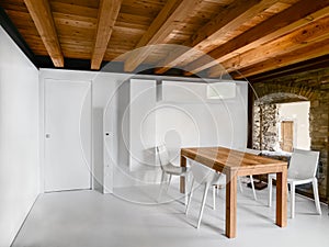 interior shots of a modern dining room with wooden table