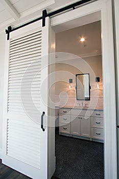 Interior sliding barn doors into bathroom