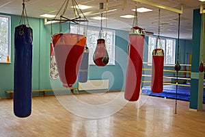 Interior of a spacious gym with punching bags