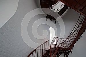 Interior Spiral Staircase and arched window inside Piedras Blancas Lighthouse on the Central California Coast