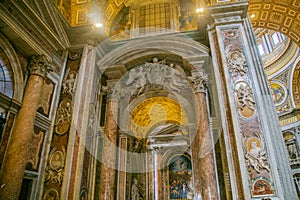 Interior of St. Peter`s Cathedral in the Vatican. Columns, paintings,