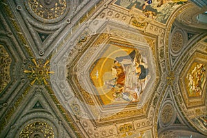 Interior of St. Peter`s Cathedral in the Vatican. Columns, paintings,