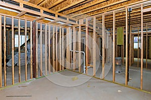 Interior stick built frame of a unfinished basement new house under construction