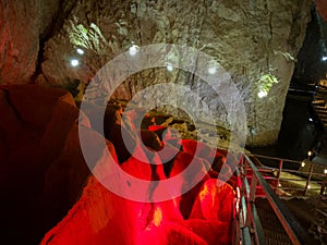 The interior of Stopica cave with tufa bathtubs illuminated with colored light, is located on the slopes of the Zlatibor mountain