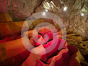 The interior of Stopica cave with tufa bathtubs illuminated with colored light, is located on the slopes of the Zlatibor mountain