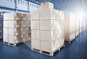 Interior of Storage Warehouse. Stacked of Package Boxes on Wooden Pallet in The Warehouse. Shipment Boxes. Cargo Export- Import.