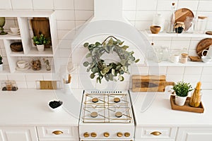 Interior of a stylish cozy modern white wooden kitchen