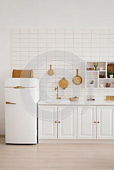 Interior of a stylish cozy modern white wooden kitchen