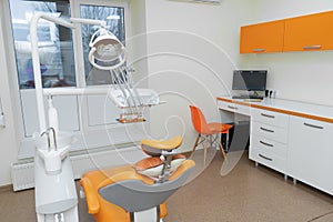 Interior stylish modern dentist office in orange style