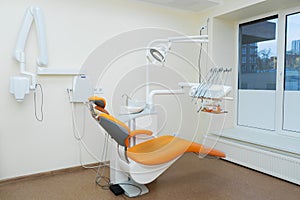 Interior stylish modern dentist office in orange style