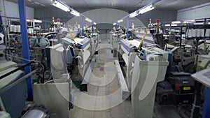 Interior of Textile factory with automated machinery.Concept of Industry and Technology.