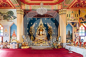 Interior of Thai Monastery Thai Temple decorated with Thai art and Golde Lord Buddha Statue in the center at Bodh Gaya, Bihar.