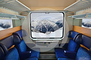 Interior of train and mountains in window