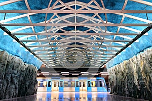Interior of a Stockholm Metro Station With a Train photo