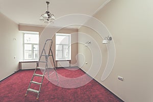 Interior of upgrade apartment with ladder and some bathroom fixtures after the remodeling, renovation, extension, restoration