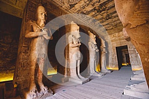 Interior View with an Ancient Egyptian Statues of Ramesses linked to the god Osiris in the Great Temple at Abu Simbel