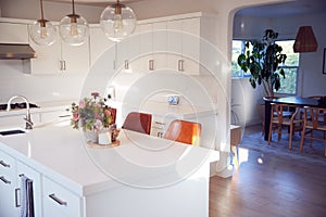 Interior View Of Beautiful Kitchen With Island Counter Looking To Dining Room In New Family House