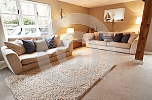 Interior View Of Beautiful Lounge With Sofas And Soft Furnishings In Family House