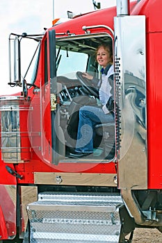 Interior View Of Big Rig With Woman Truck Driver