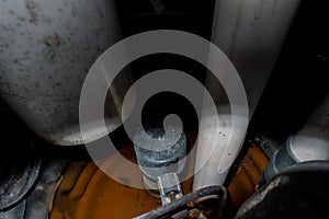 Interior view of dark sump pit with pump and float switch visible in dim light