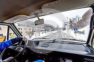 Interior view of delivery man driving a van or truck.