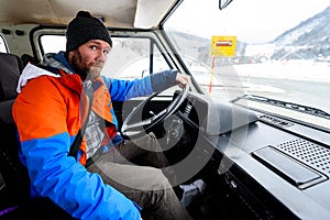 Interior view of delivery man driving a van or truck.