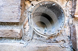 Interior view of dryer vent line with lint and dust buildup